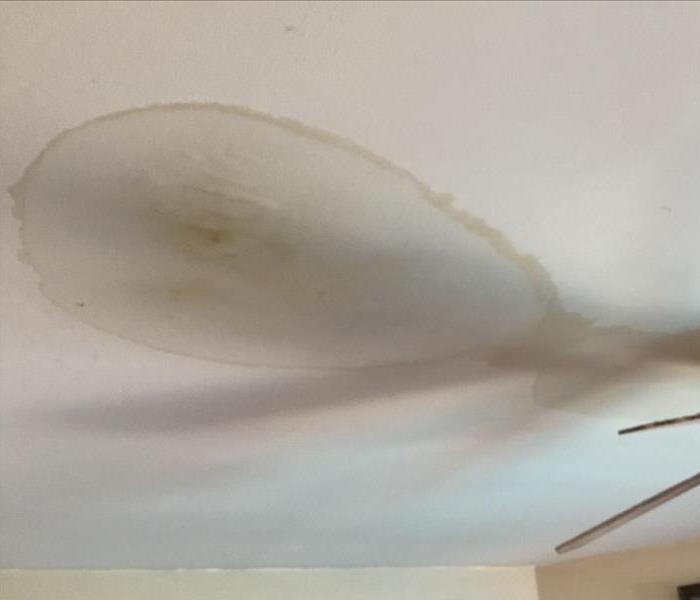 Water damage to ceiling from damage above.