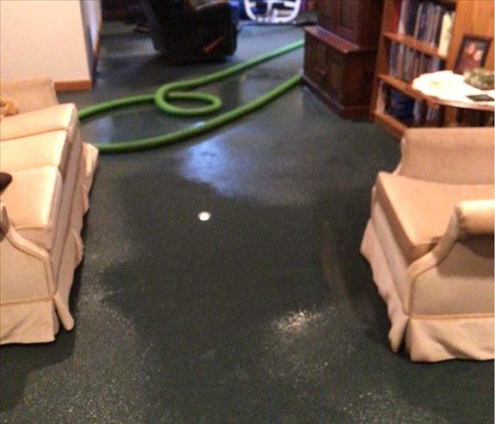 Soaked carpeting caused by storm damage.
