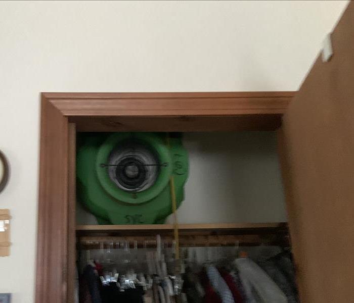 Fan placed in the closet for drying purposes.