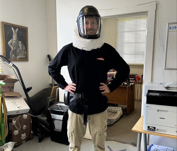 SERVPRO employee in a new respirator.